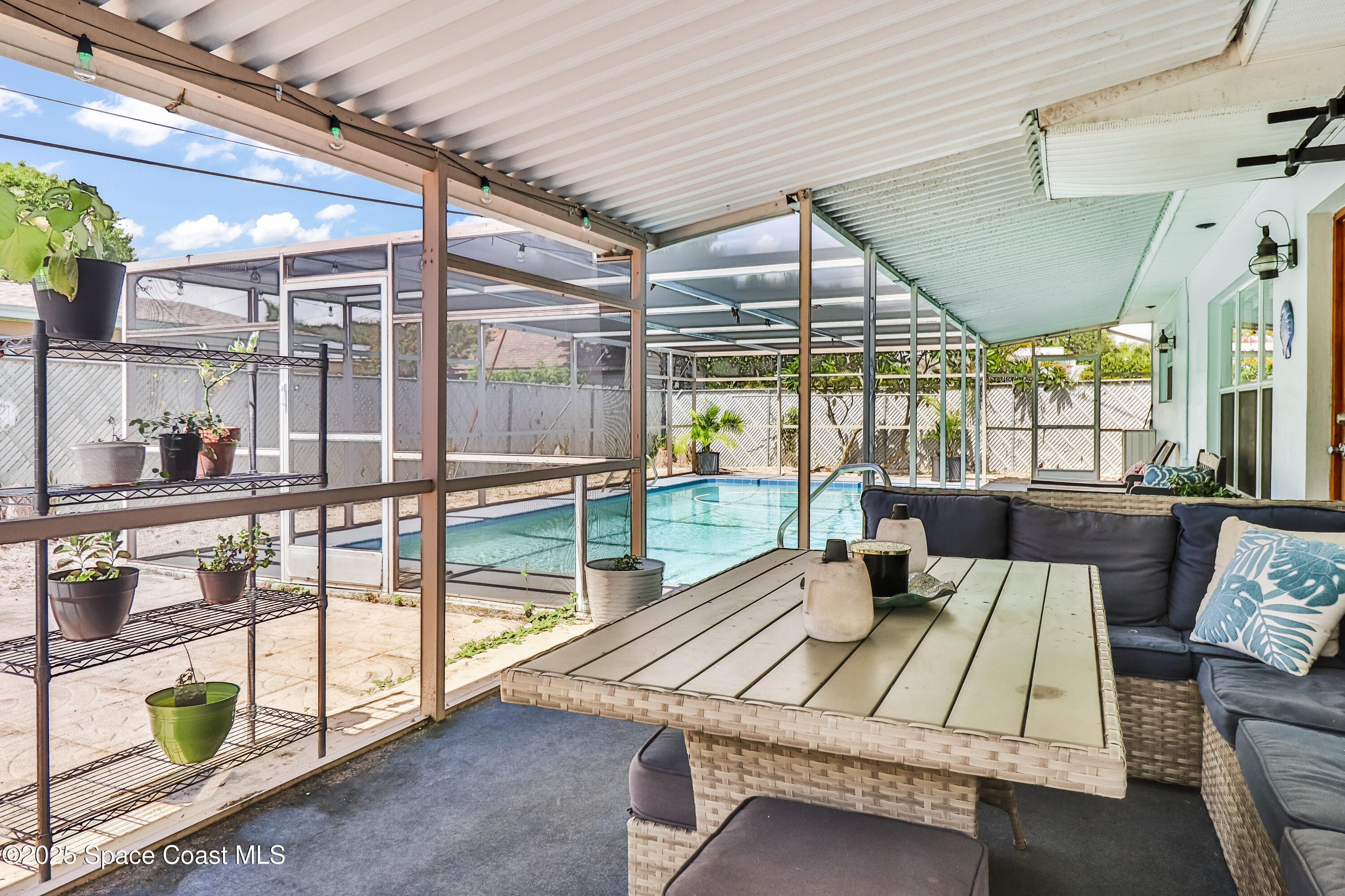 348 Berkeley Street Satellite Beach, FL 32937 - Photo 3 of 46 a outdoor space with patio lots of furniture