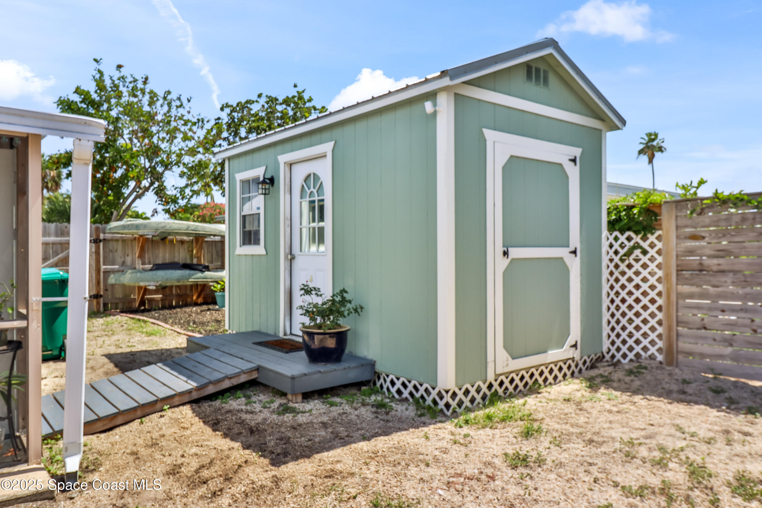 348 Berkeley Street Satellite Beach, FL 32937 - Photo 32 of 46 a house view with a outdoor space