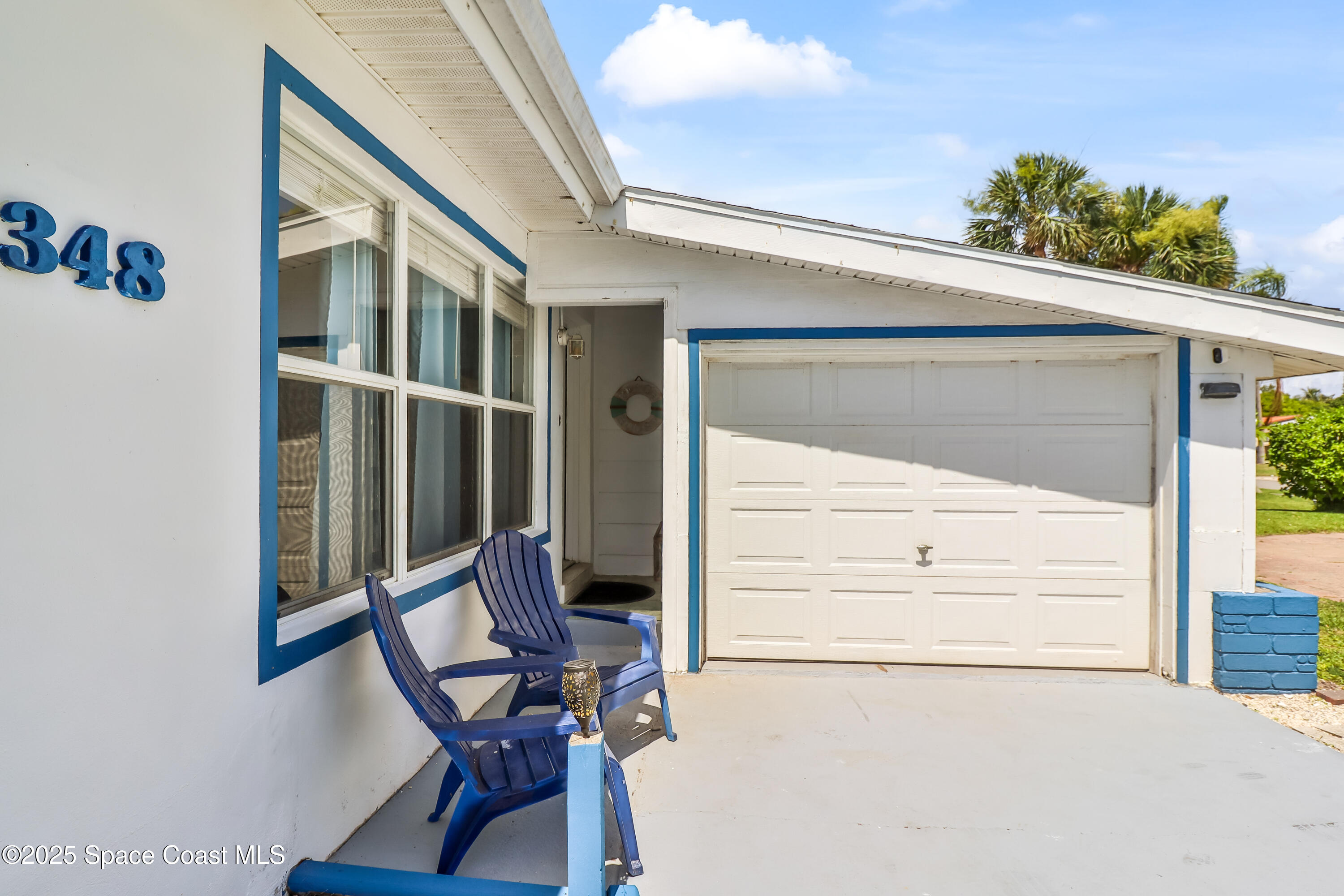348 Berkeley Street Satellite Beach, FL 32937 - Photo 4 of 46 a view of a chair and table in the balcony