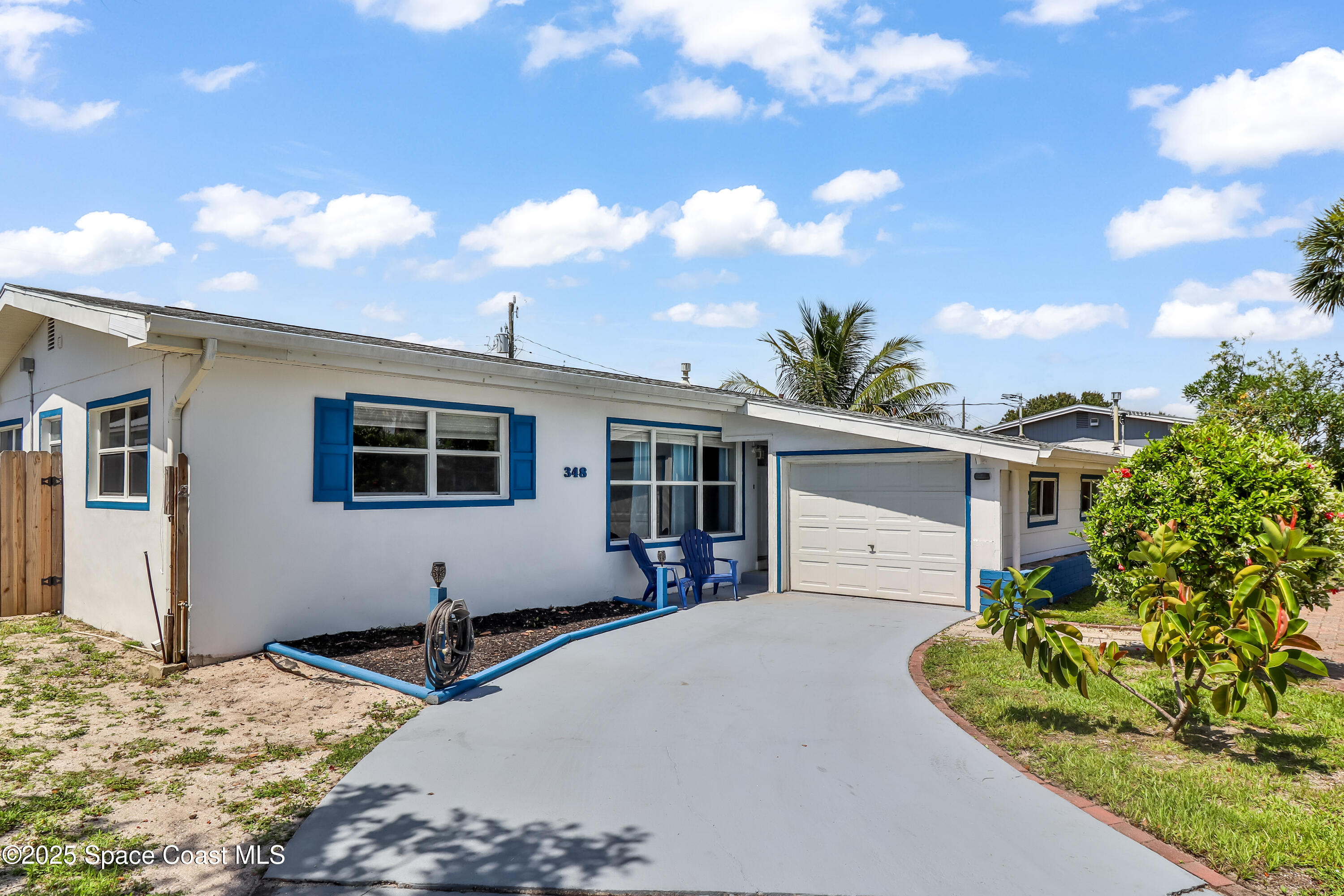 348 Berkeley Street Satellite Beach, FL 32937 - Photo 5 of 46 a house view with a backyard space