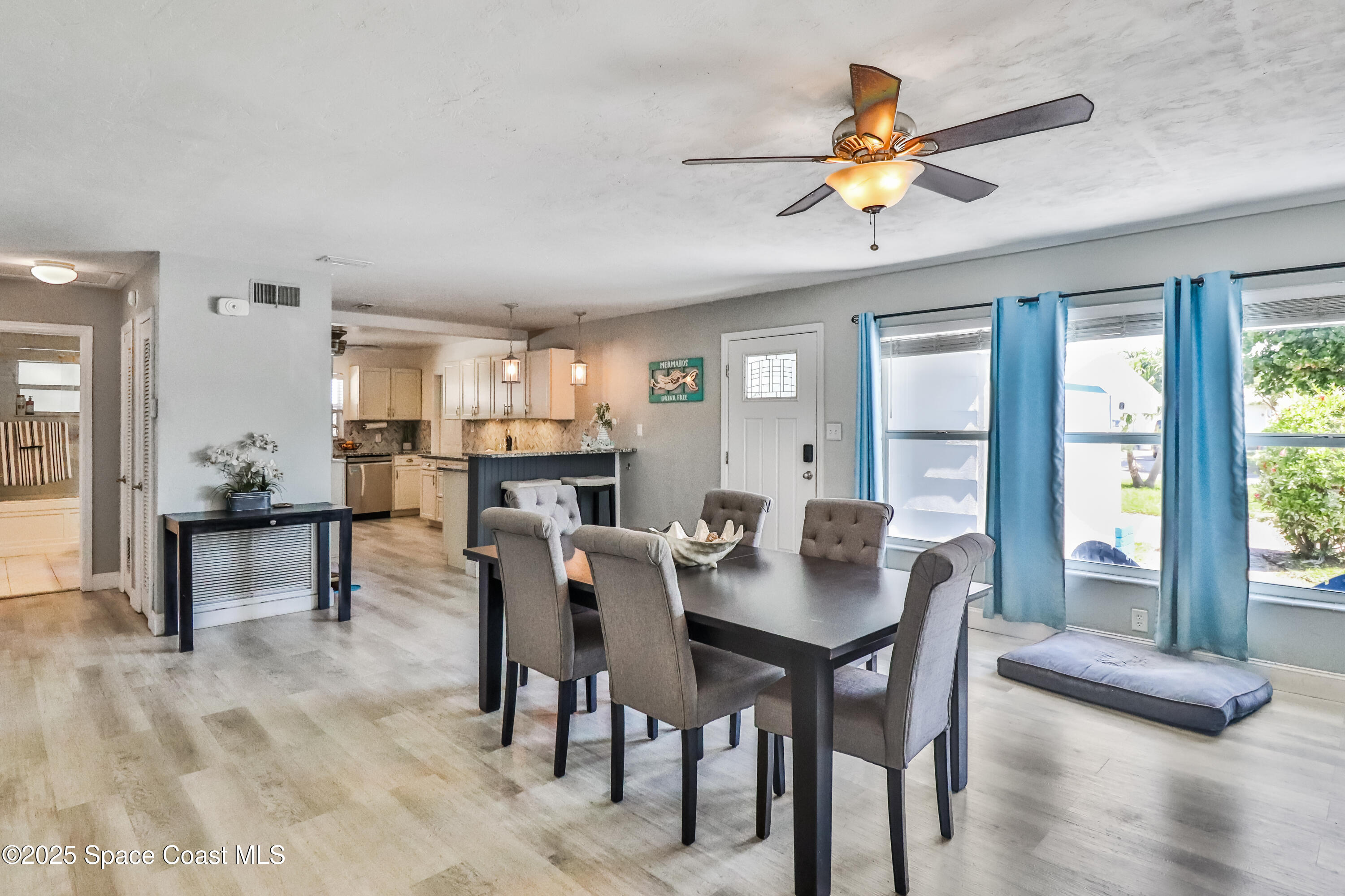 348 Berkeley Street Satellite Beach, FL 32937 - Photo 8 of 46 a view of a dining room with furniture and window