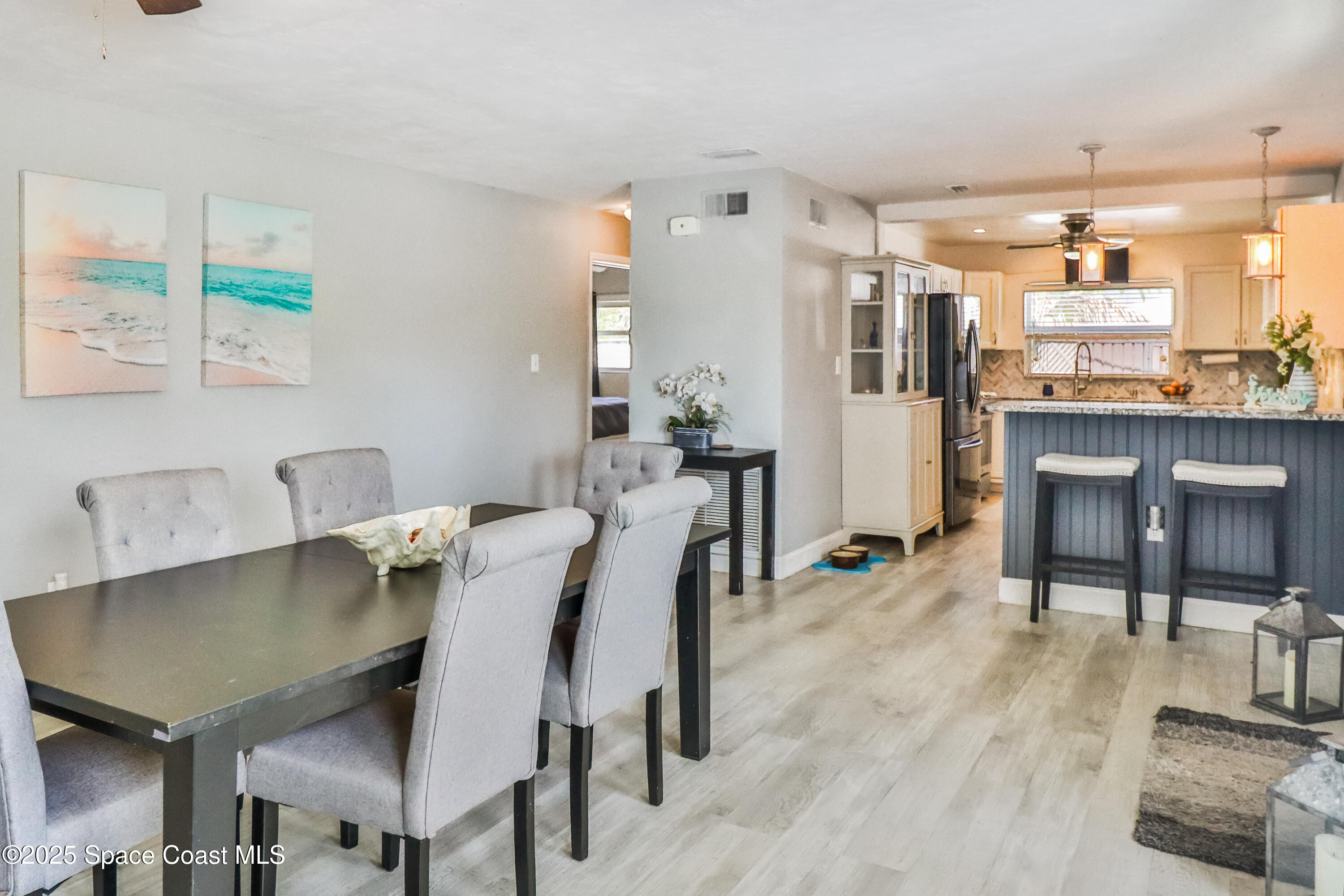 348 Berkeley Street Satellite Beach, FL 32937 - Photo 9 of 46 a view of a dining room with furniture