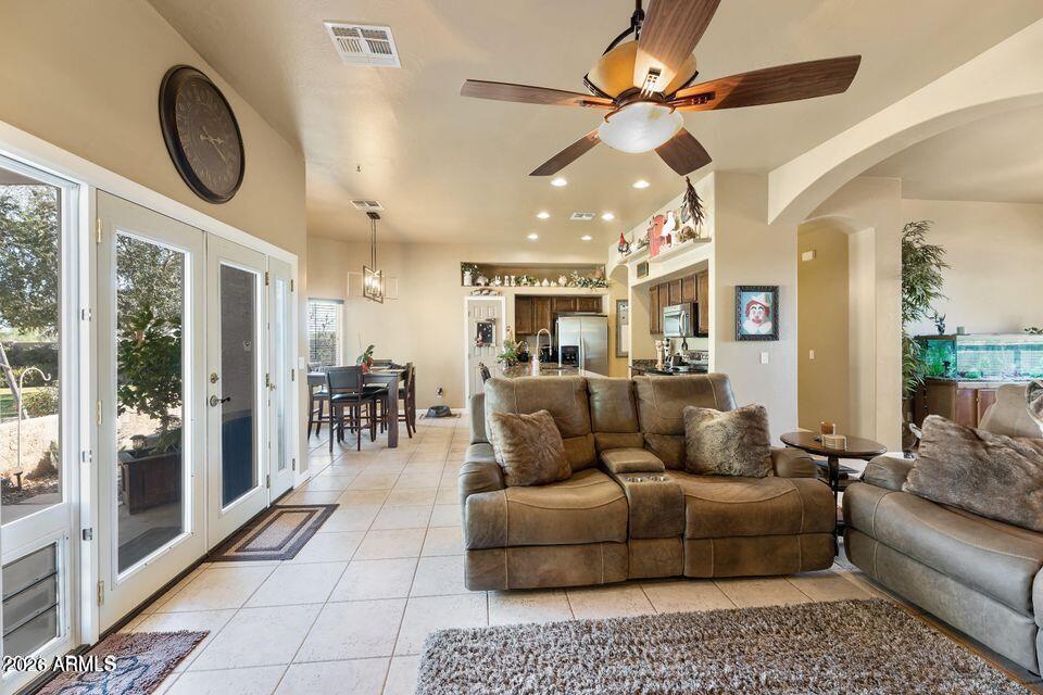 37005 North 7th Street Phoenix, AZ 85086 - Photo 17 of 48 a living room with furniture and a large window with kitchen view