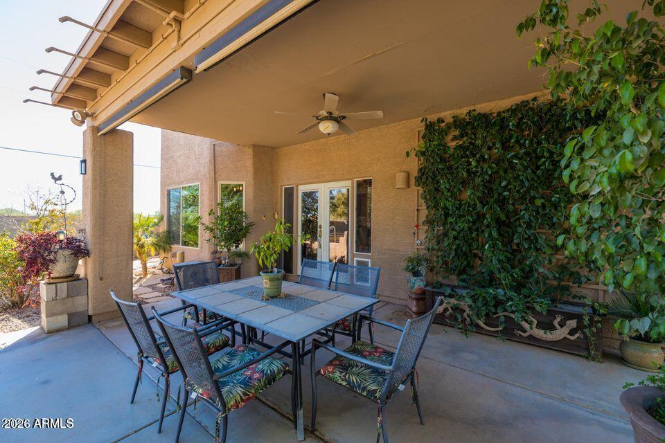 37005 North 7th Street Phoenix, AZ 85086 - Photo 23 of 48 a view of an outdoor dining space with a table and chairs