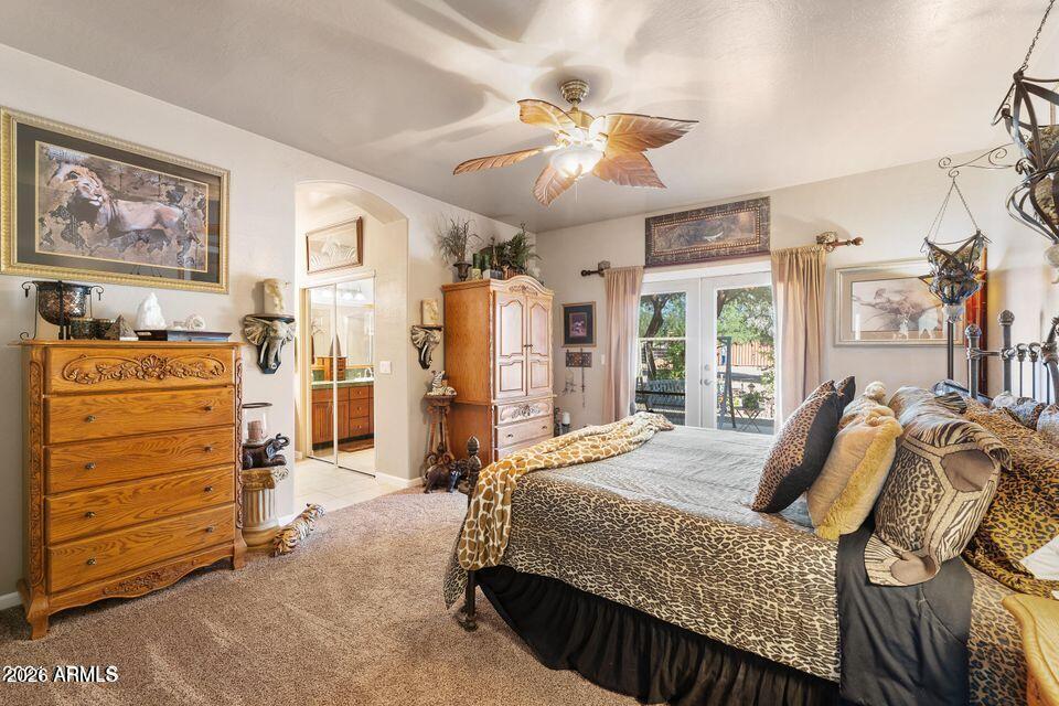 37005 North 7th Street Phoenix, AZ 85086 - Photo 6 of 48 a bedroom with a bed and a chandelier