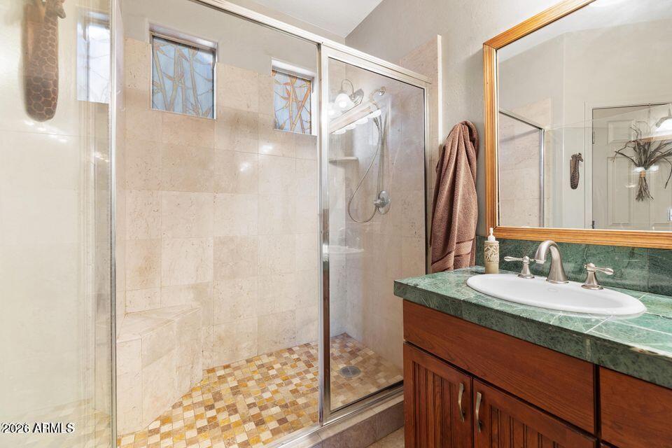 37005 North 7th Street Phoenix, AZ 85086 - Photo 8 of 48 a bathroom with a granite countertop shower sink and mirror
