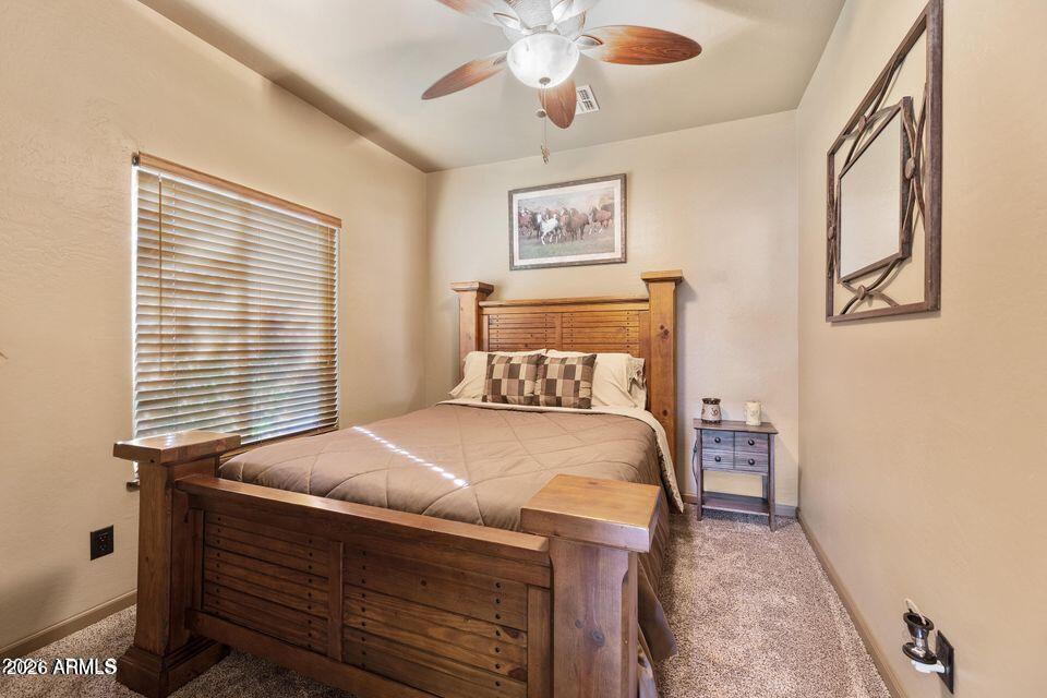 37005 North 7th Street Phoenix, AZ 85086 - Photo 10 of 48 a bedroom with a bed and a chandelier