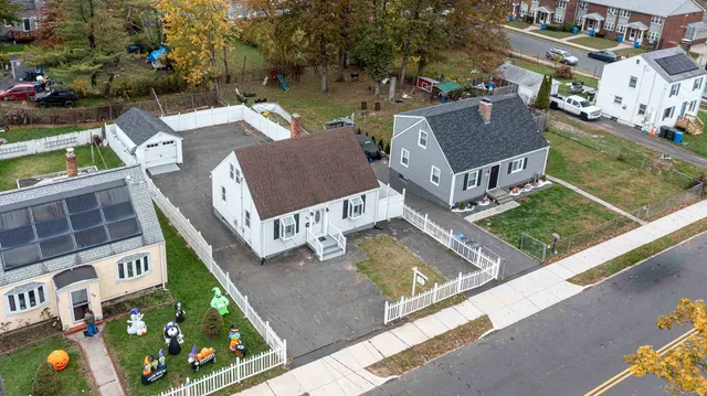 a view of a patio with chairs and plants