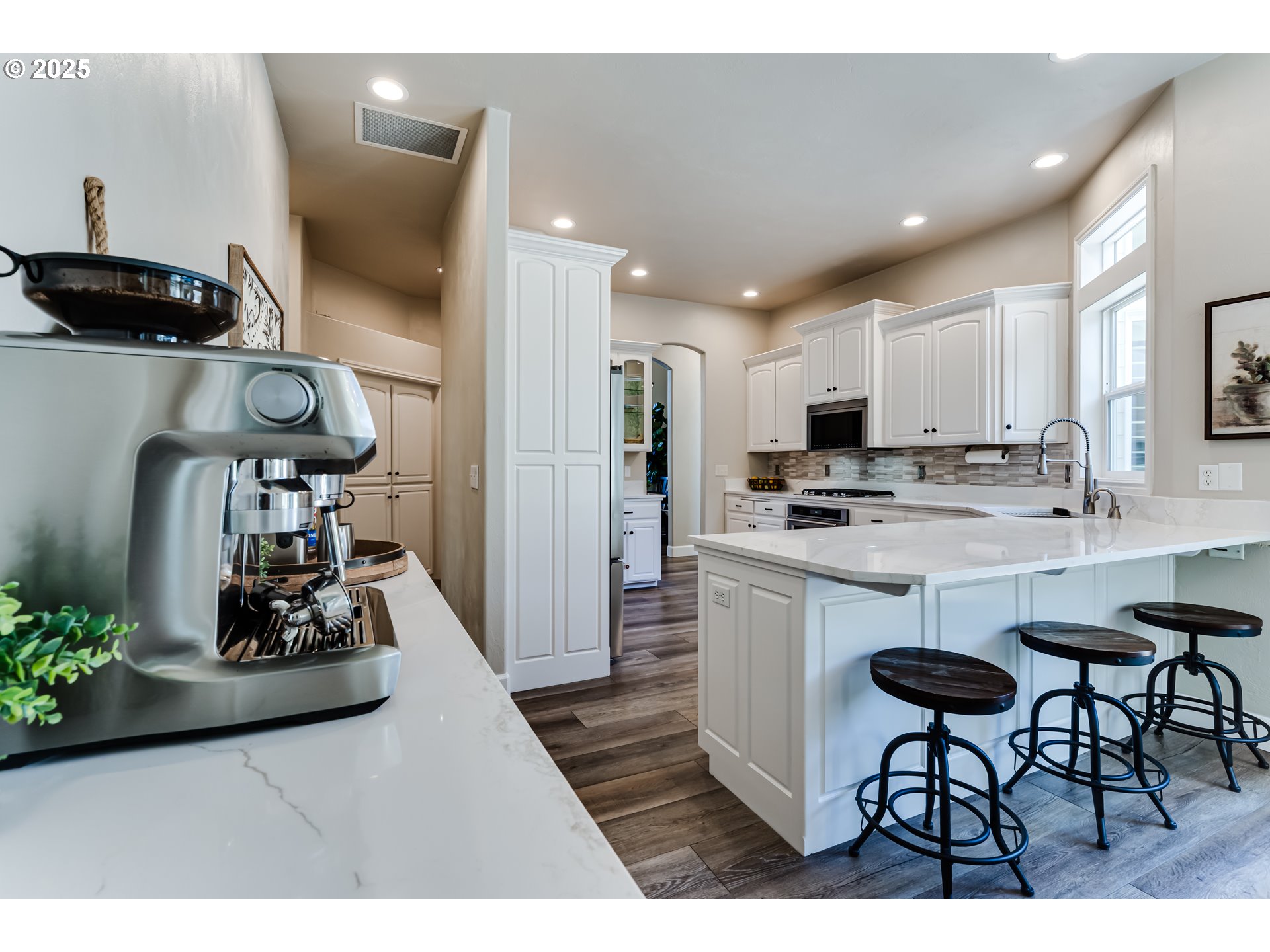 3193 Metolius Drive Eugene, OR 97408 - Photo 19 of 39 a kitchen with stainless steel appliances kitchen island granite countertop a sink and cabinets
