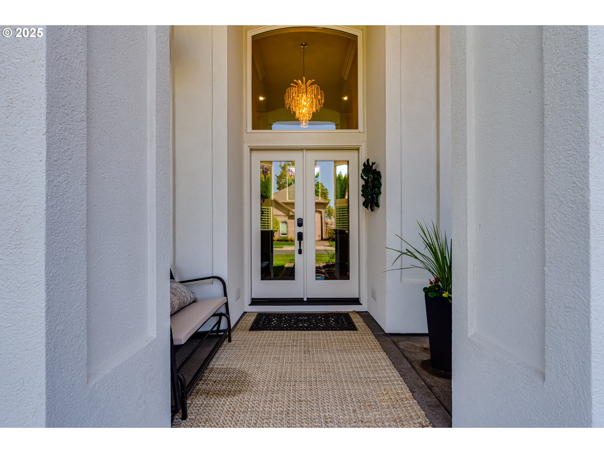 3193 Metolius Drive Eugene, OR 97408 - Photo 5 of 39 a view of a hallway with wooden floor and a potted plant