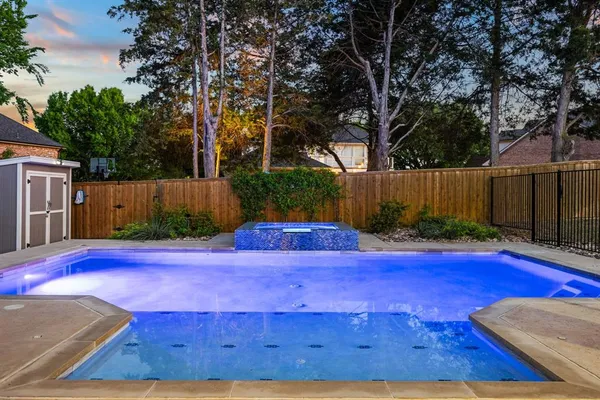 a kitchen with stainless steel appliances sink stove top oven and cabinets