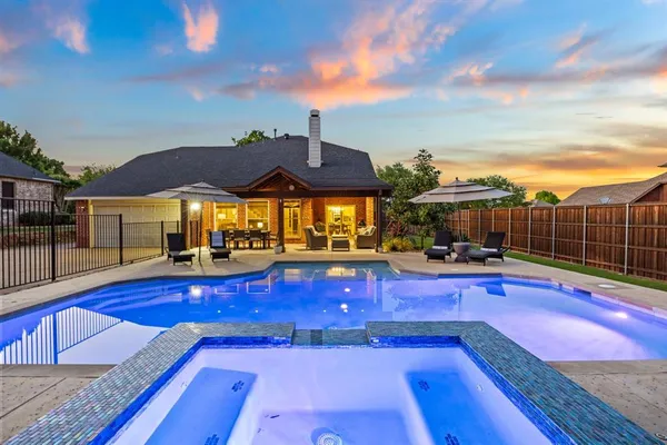 a kitchen with counter top space a sink cabinets and appliances