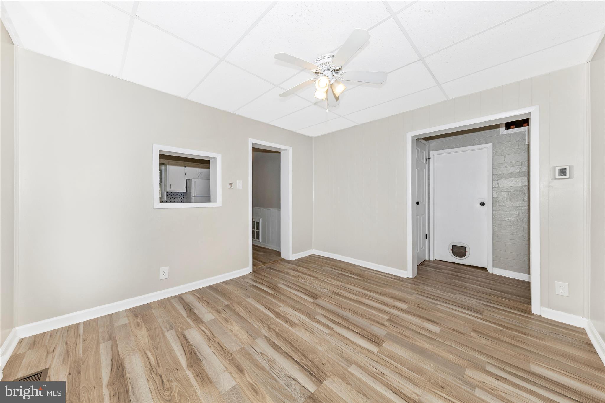 148 Hamilton Avenue Waynesboro, PA 17268 - Photo 13 of 50 a view of an empty room with wooden floor