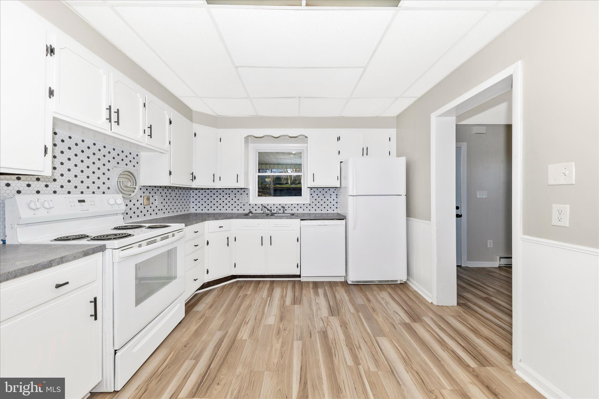 148 Hamilton Avenue Waynesboro, PA 17268 - Photo 16 of 50 a kitchen with stainless steel appliances a white cabinets and sink