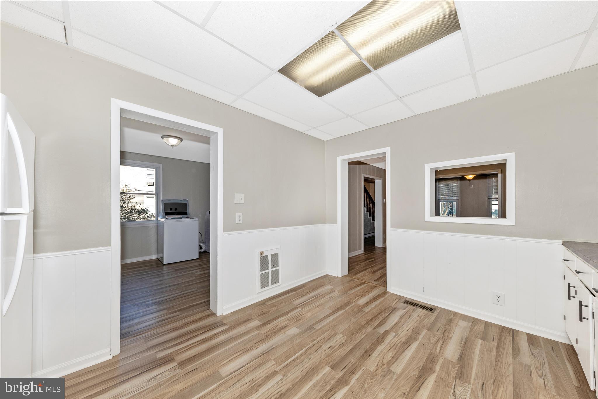 148 Hamilton Avenue Waynesboro, PA 17268 - Photo 18 of 50 a view of a hallway with wooden floor and a living room