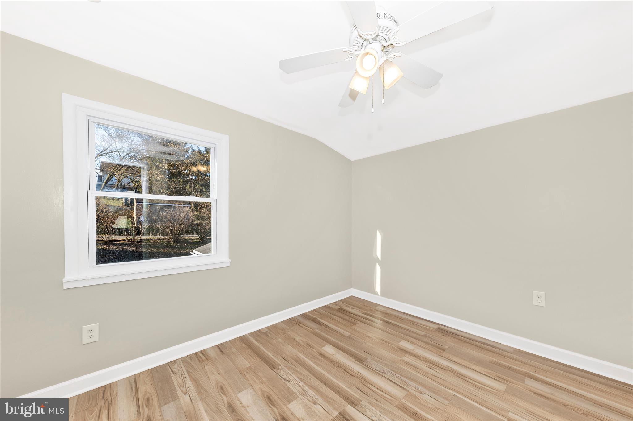 148 Hamilton Avenue Waynesboro, PA 17268 - Photo 29 of 50 an empty room with a window and a ceiling fan