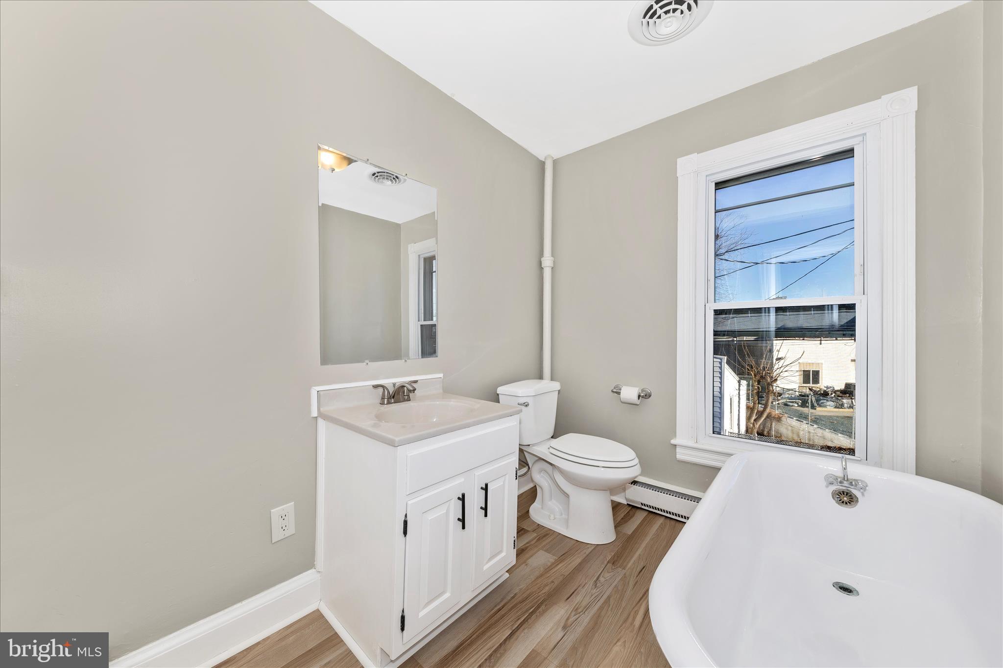 148 Hamilton Avenue Waynesboro, PA 17268 - Photo 35 of 50 a bathroom with a white tub a sink and a large mirror