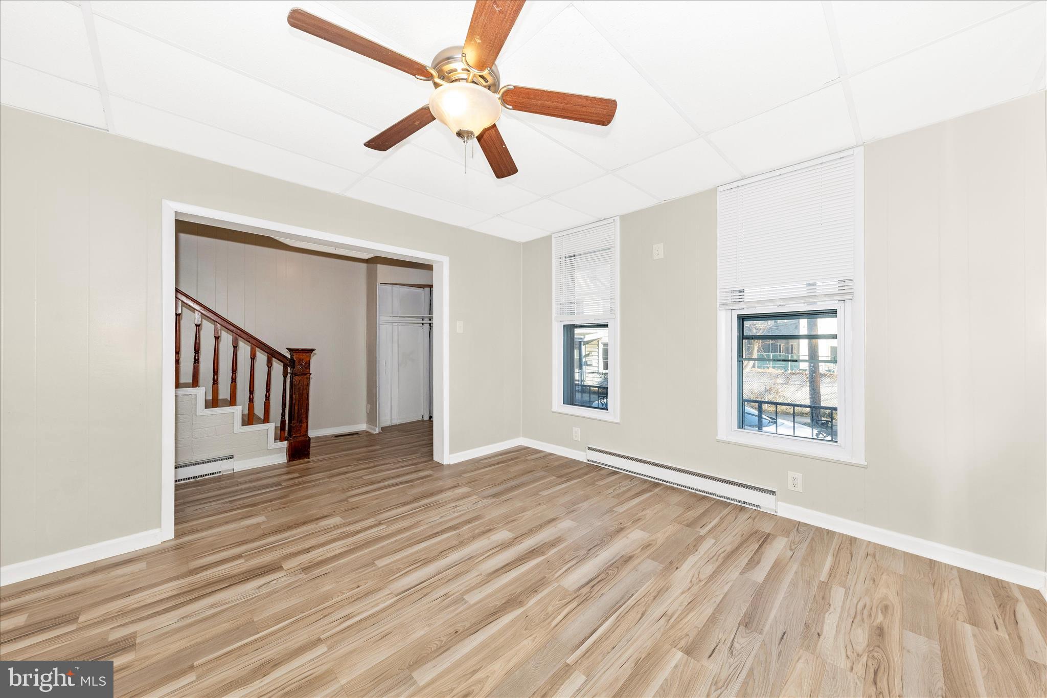 148 Hamilton Avenue Waynesboro, PA 17268 - Photo 8 of 50 a view of an empty room with wooden floor and a window