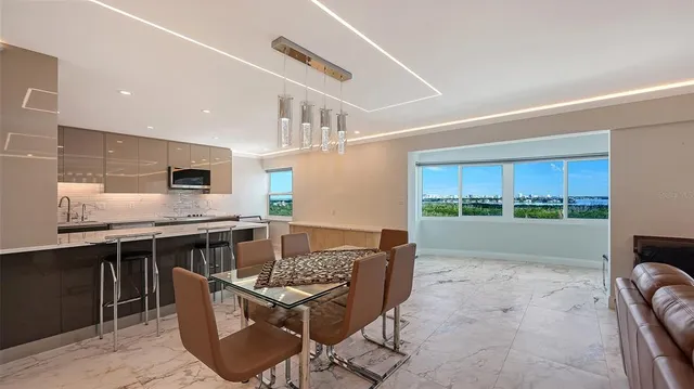 a bedroom with a large bed and a large window