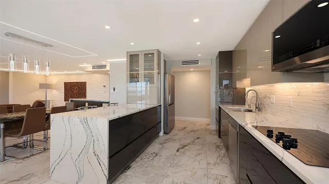 a bathroom with a sink toilet tub and shower