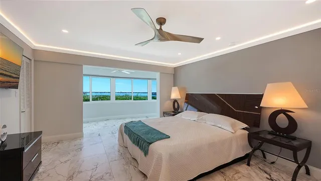 a view of a dining room with furniture wooden floor and chandelier