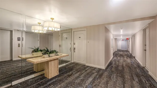 a living room with furniture a rug and a window