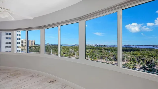 a large kitchen with kitchen island a sink stove and refrigerator