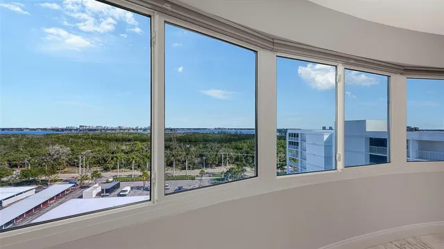 a large kitchen with a large counter top stainless steel appliances and cabinets
