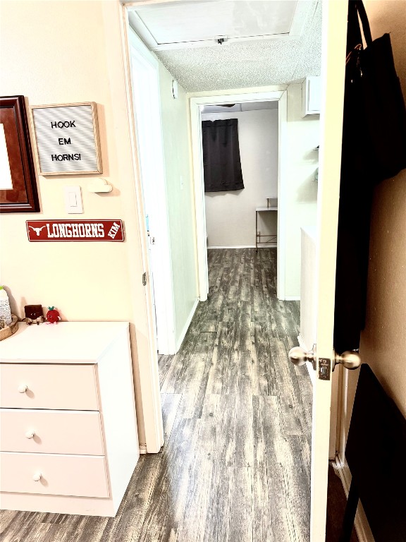 2413 Leon Street, Unit 108 Austin, TX 78705 - Photo 11 of 22 view of hallway with furniture and wooden floor