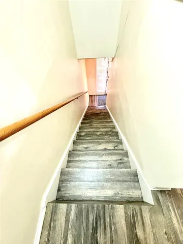 a kitchen with stainless steel appliances granite countertop a stove refrigerator and cabinets