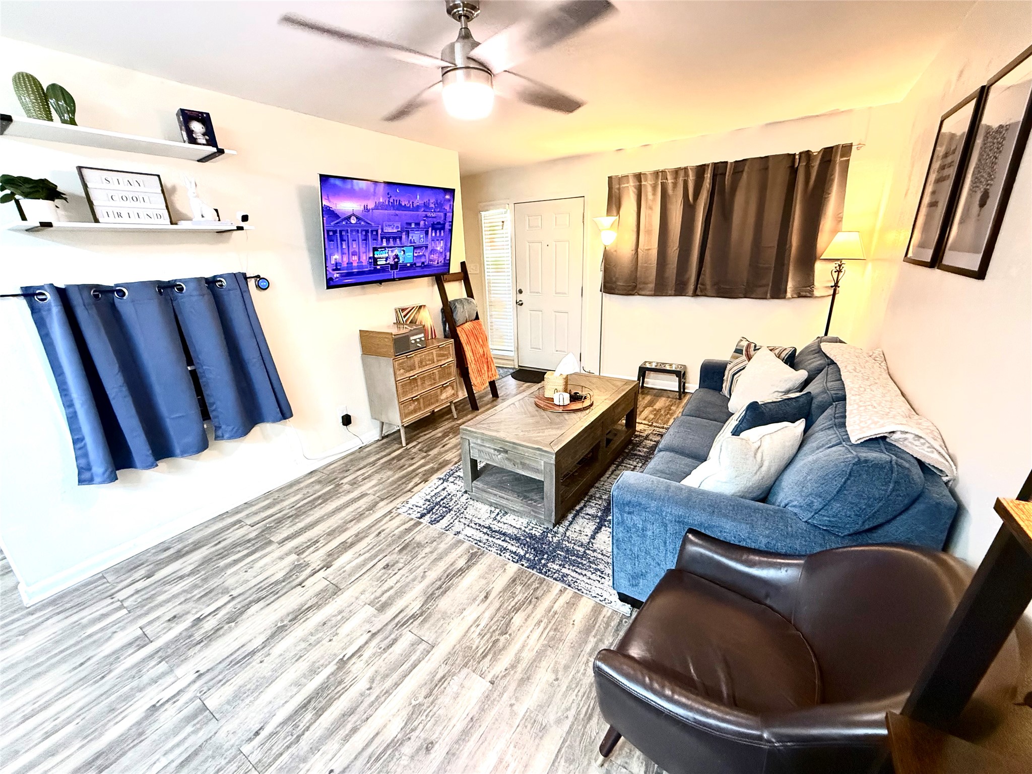 2413 Leon Street, Unit 108 Austin, TX 78705 - Photo 7 of 22 a living room with furniture rug and wooden floor