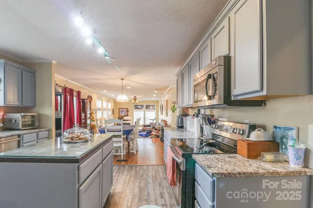 a kitchen with granite countertop lots of counter top space