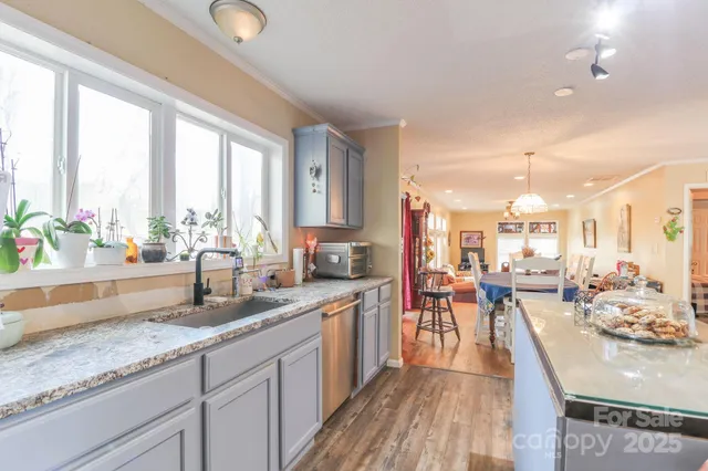 a kitchen with sink stove and cabinets