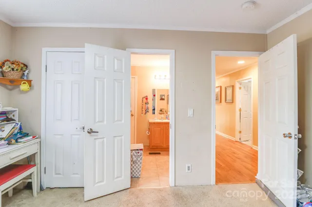 a view of a bathroom with a walk in closet