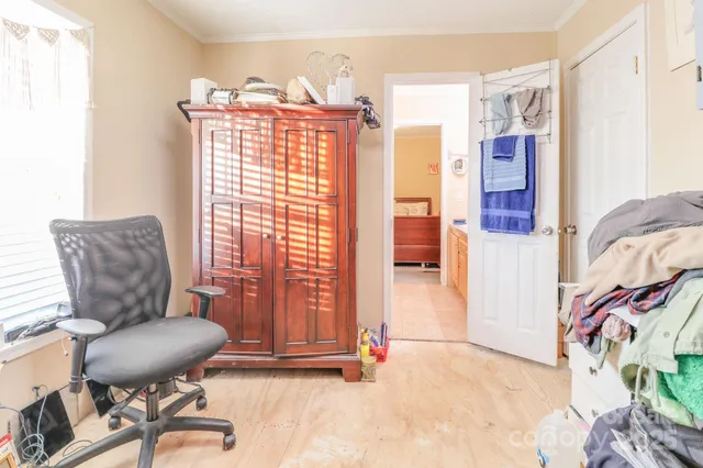 a view of a livingroom with furniture and a large window