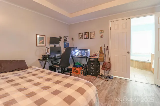 a bedroom with a bed and a chair