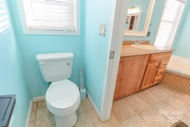 a bathroom with a toilet and a sink