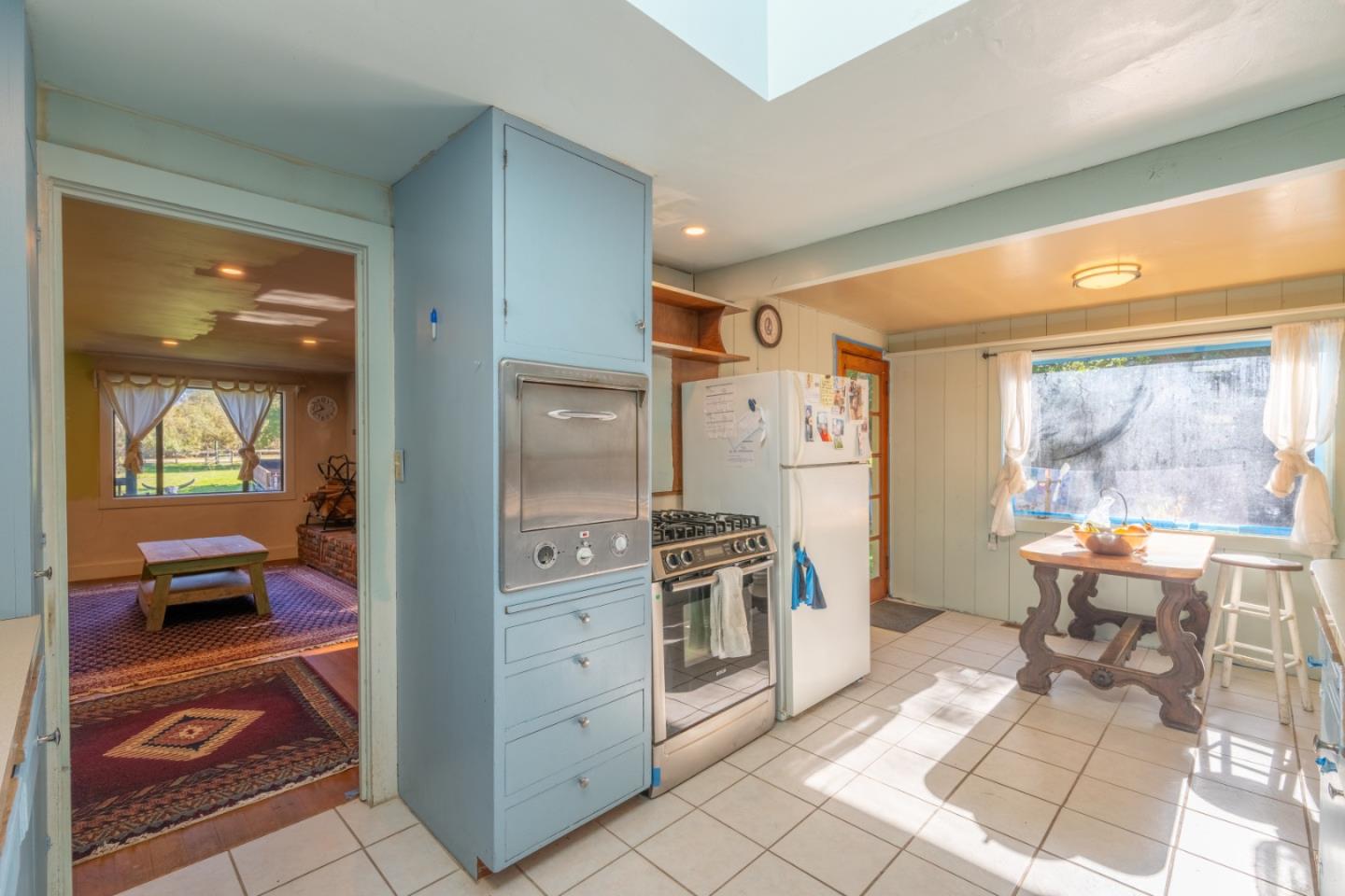27415 Schulte Road Carmel, CA 93923 - Photo 6 of 30 a kitchen with stainless steel appliances granite countertop a refrigerator and a stove