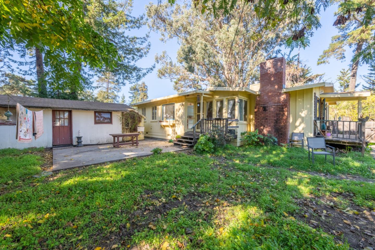 27415 Schulte Road Carmel, CA 93923 - Photo 10 of 30 a front view of a house with patio and garden