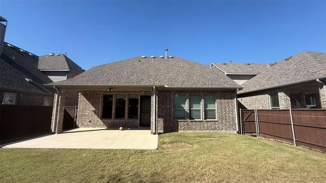 a view of a house with wooden floor and a wooden fence