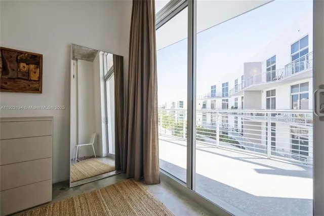 a view of a balcony with wooden floor