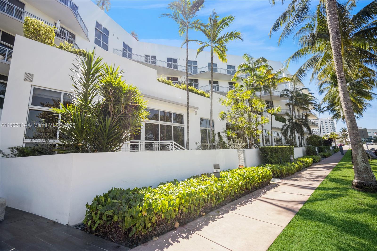 2001 Meridian Avenue, Unit 512 Miami Beach, FL 33139 - Photo 29 of 32 a front view of a house with a garden