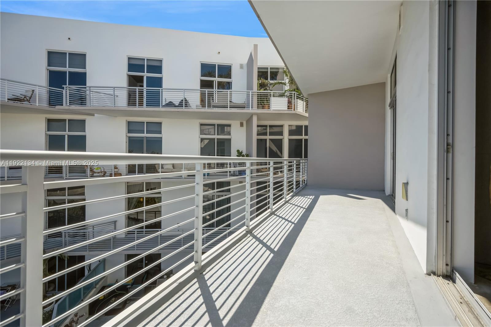 2001 Meridian Avenue, Unit 512 Miami Beach, FL 33139 - Photo 6 of 32 a view of balcony with wooden floor and fence