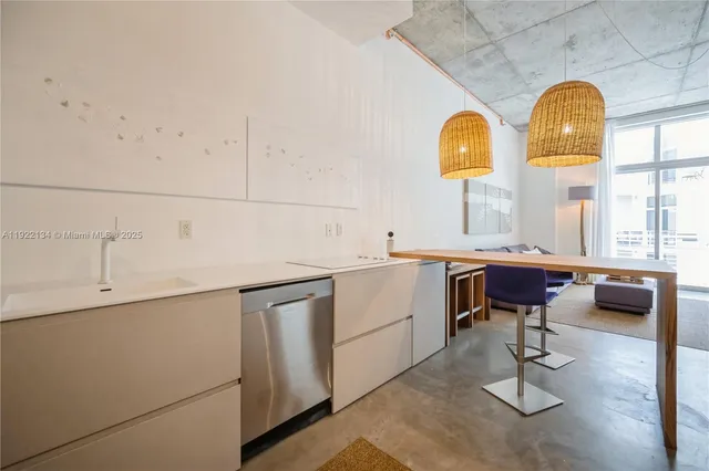 a kitchen with a sink and a window