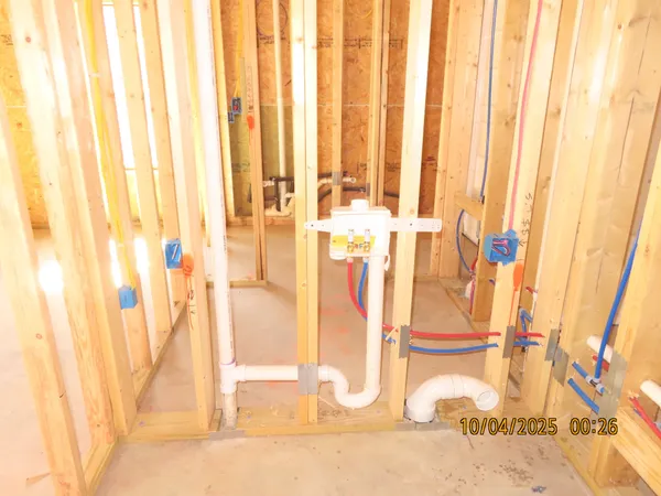 a view of a bathroom with shower and curtain