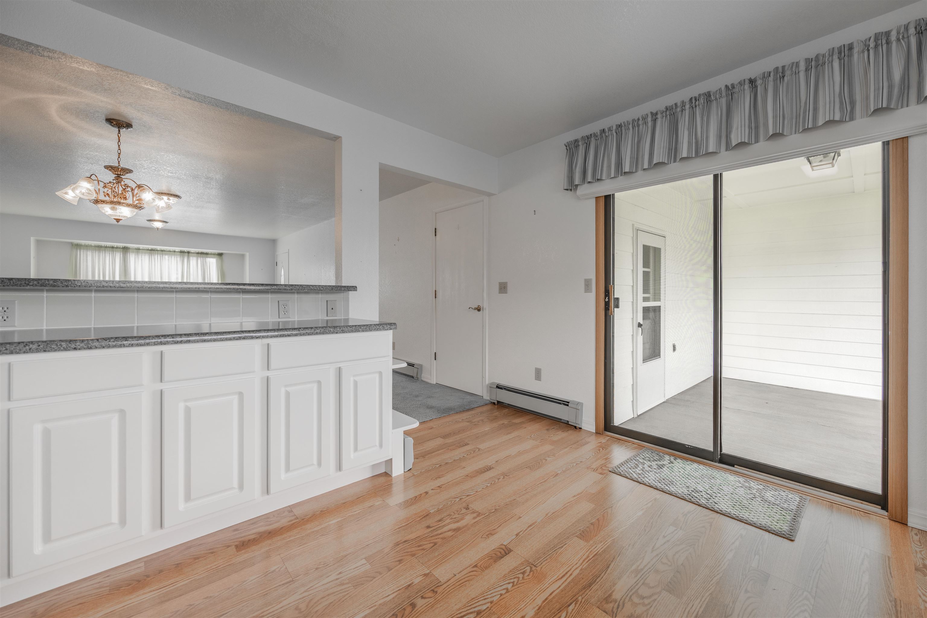 2135 Winston Way, Unit B Montrose, CO 81401 - Photo 10 of 23 a kitchen with granite countertop a refrigerator a sink and cabinets