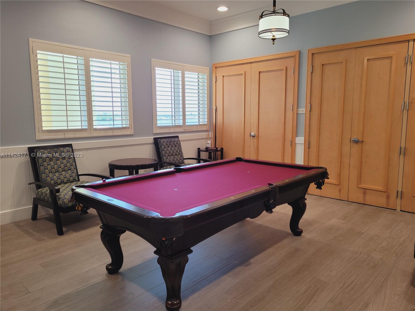 2650 Lake Shore Drive, Unit 2202 Riviera Beach, FL 33404 - Photo 25 of 29 a room with pool table and windows