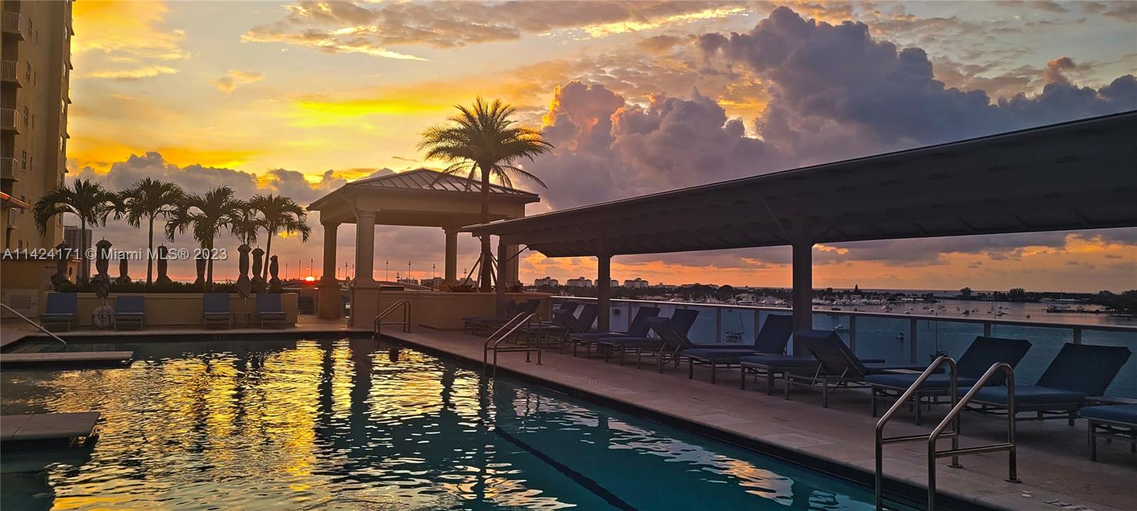 2650 Lake Shore Drive, Unit 2202 Riviera Beach, FL 33404 - Photo 6 of 29 a view of a swimming pool with a patio