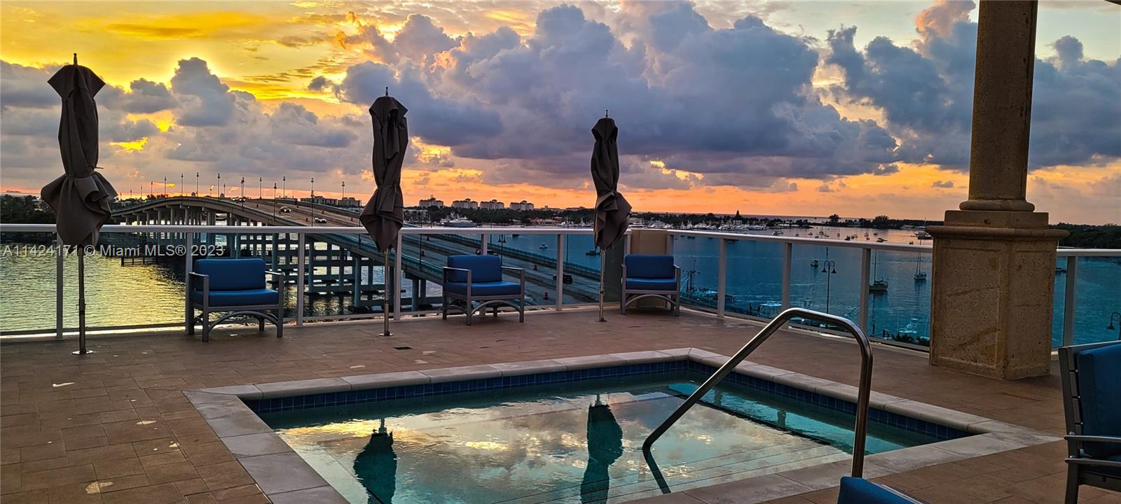 2650 Lake Shore Drive, Unit 2202 Riviera Beach, FL 33404 - Photo 7 of 29 a swimming pool with outdoor seating