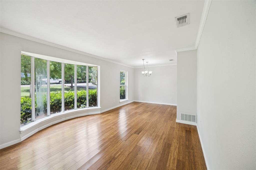 1 Glen Cove Circle Lucas, TX 75002 - Photo 12 of 37 a view of an empty room with wooden floor and a window